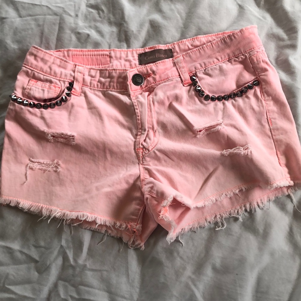 Pink studded distressed shorts